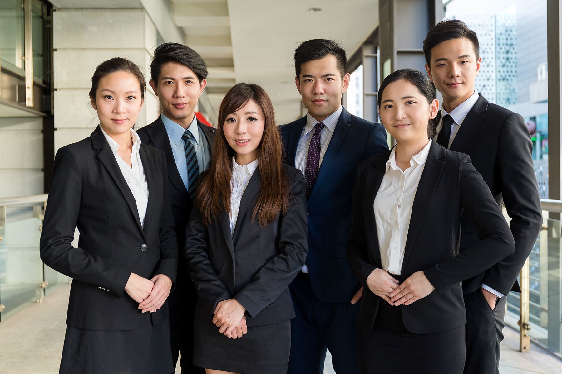 Men and woman in business formal attire - SGIP