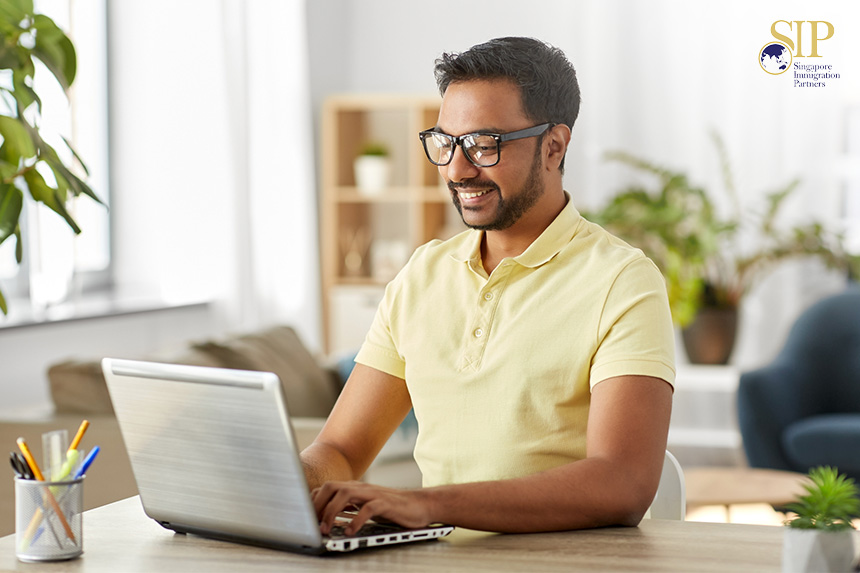 indian man using a laptop